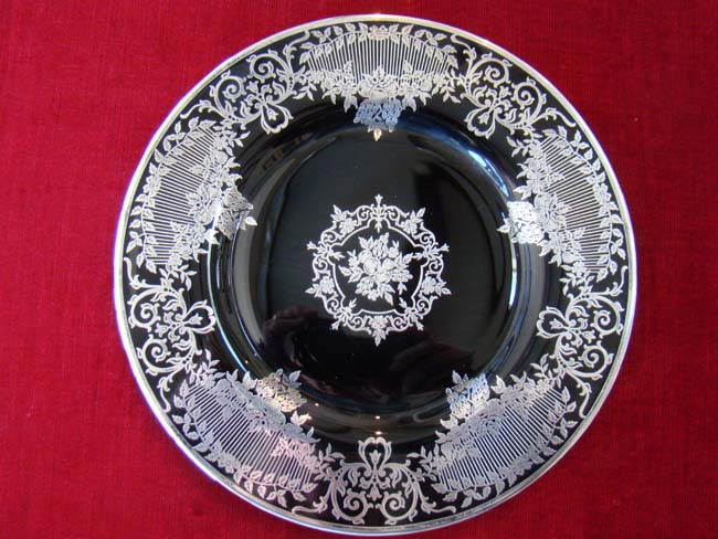 A beautiful vintage black glass serving plate with fabulous silver overlay circa 1910